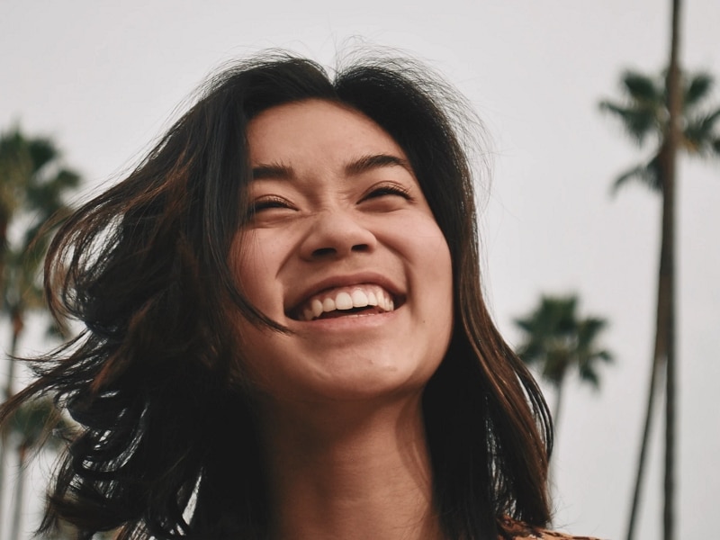 woman laughing outside