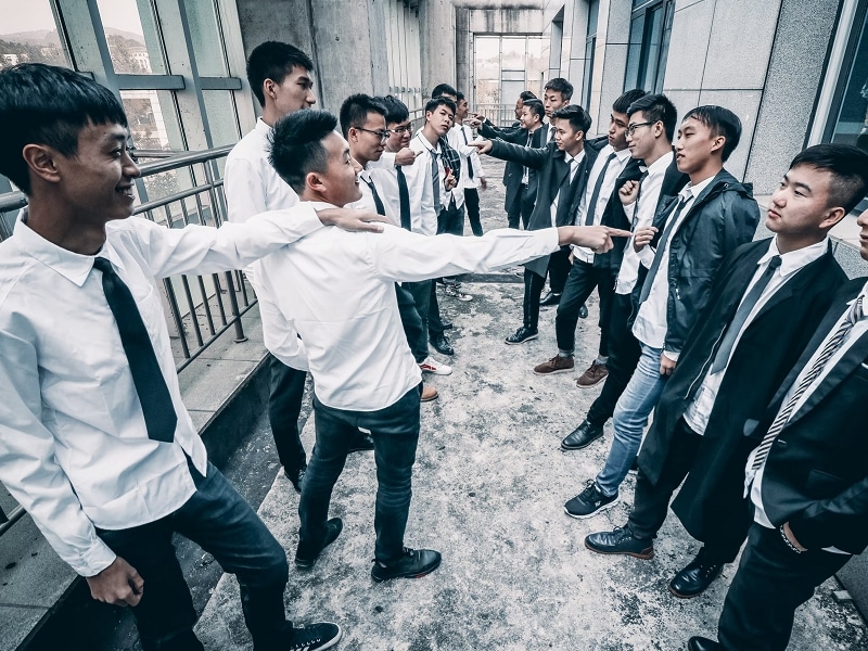 group of men laughing at each other