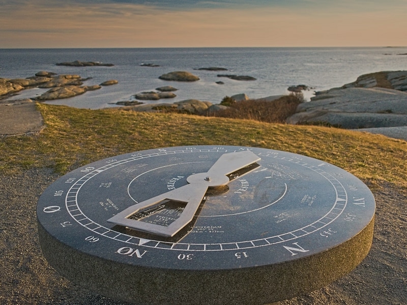 sundial near ocean