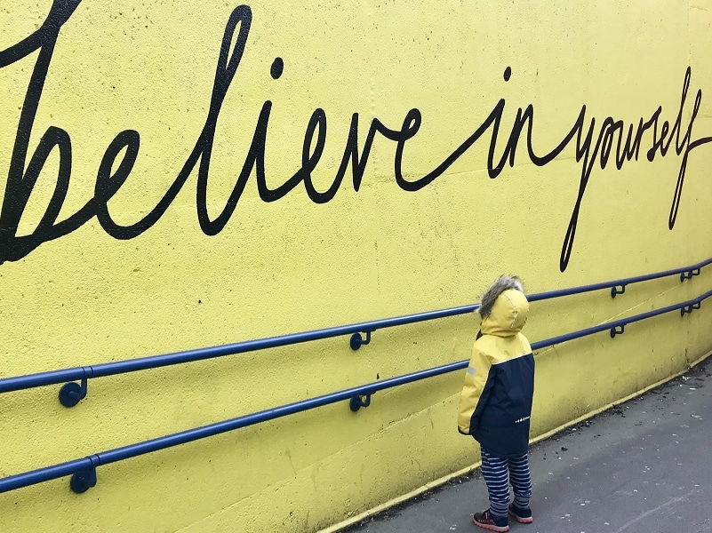 believe in yourself wall text and child
