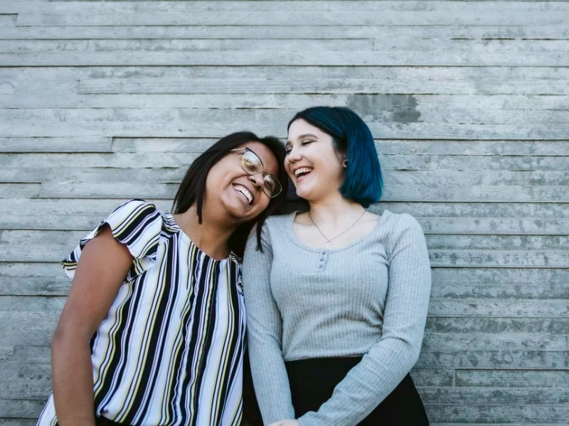 two women smiling together