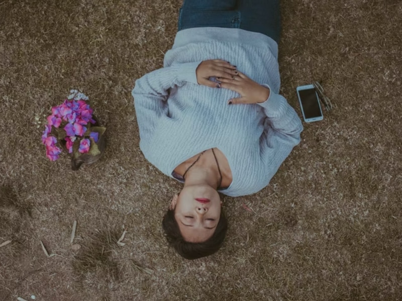 woman lying down thinking eyes closed