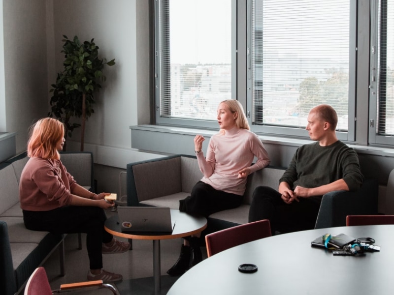 group of people discussing in a room