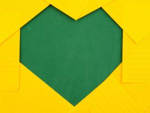 green heart shape on yellow background