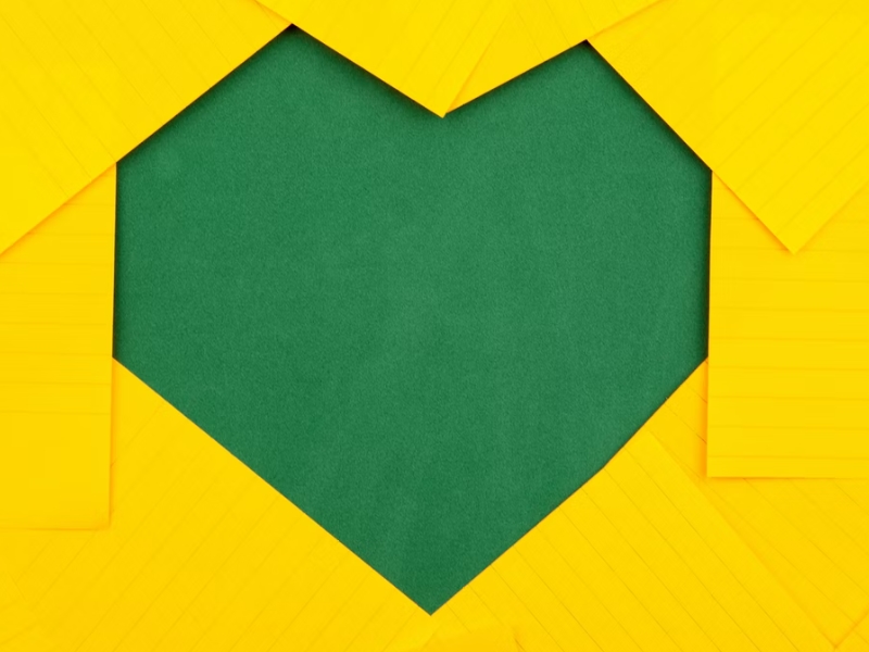 green heart shape on yellow background