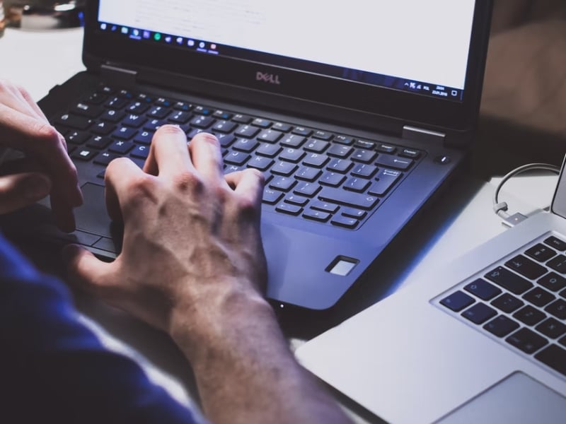 man working on laptop