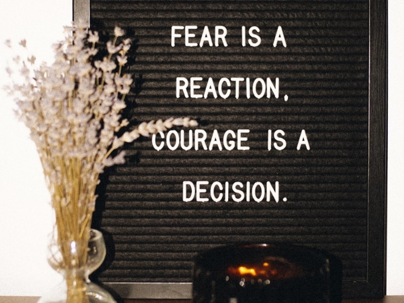fear is reaction courage is decision text board