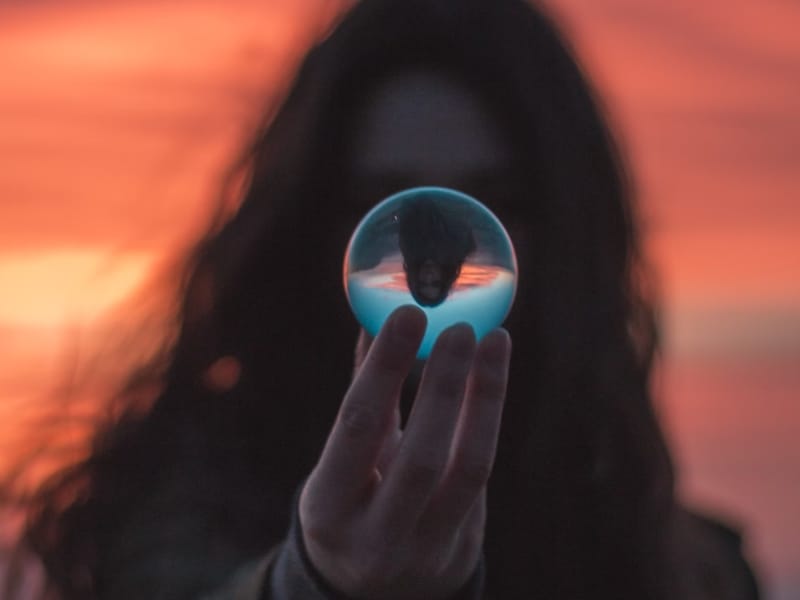 woman holding glass ball