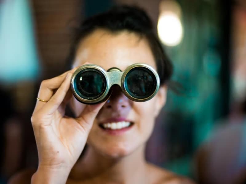 woman using binoculars