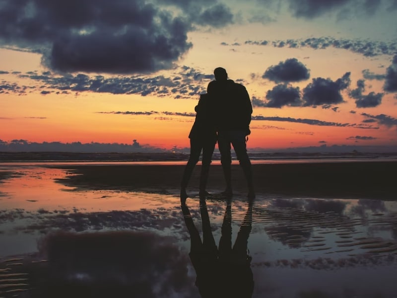 couple hugging at sunset