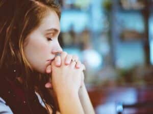 woman meditating and praying