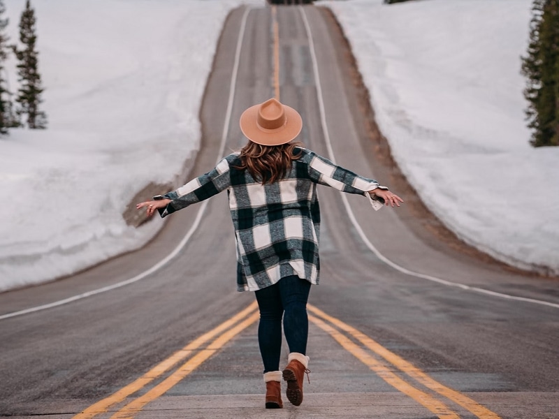 woman walking down road