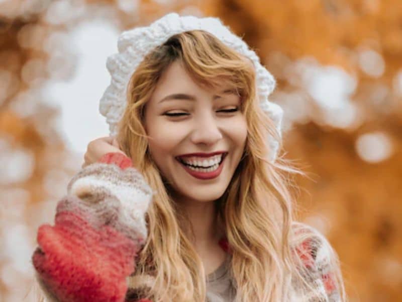 girl smiling in winter clothes