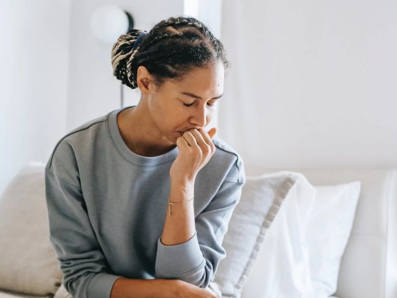 women thinking on bed