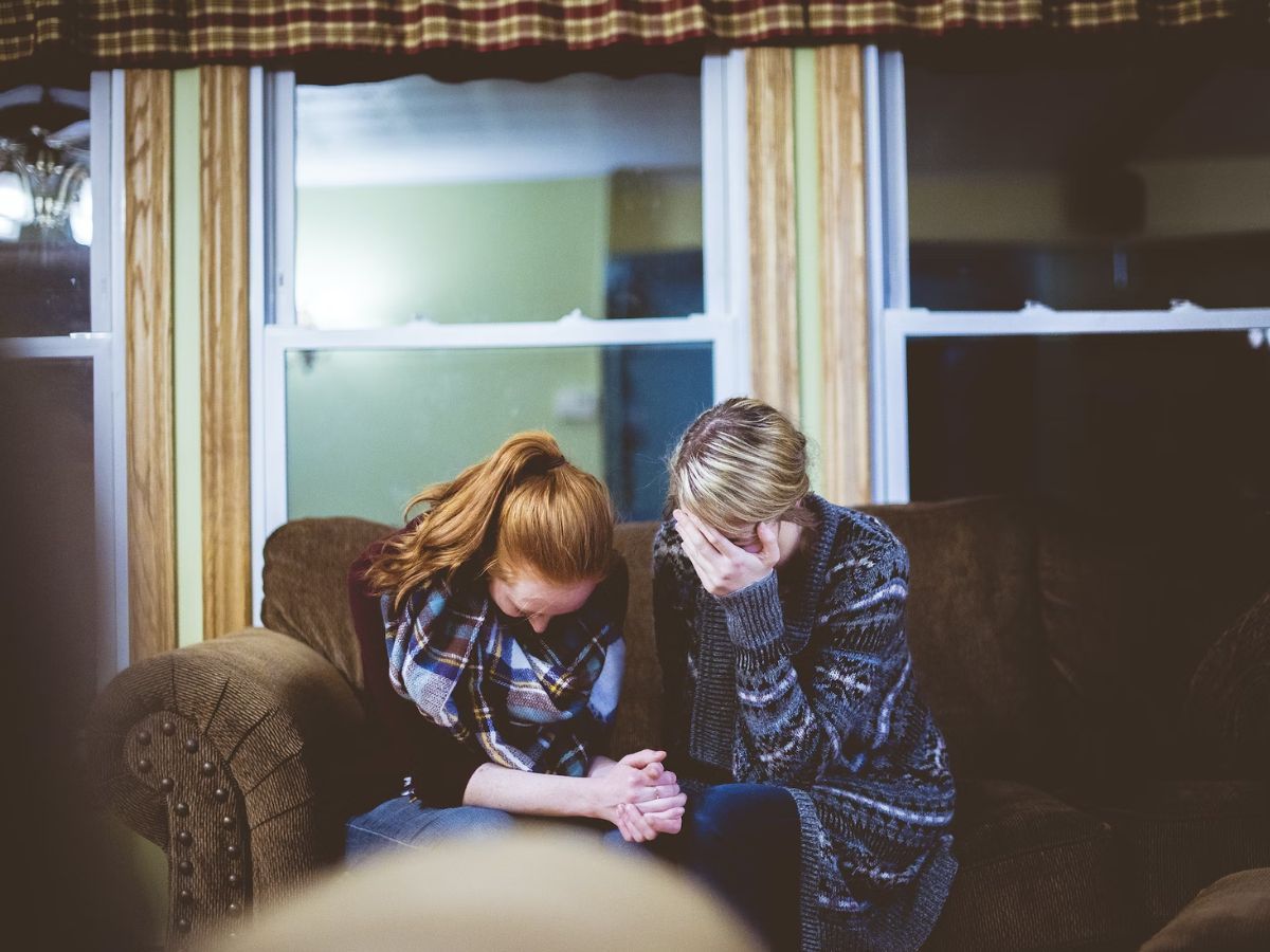 two women consoling each other