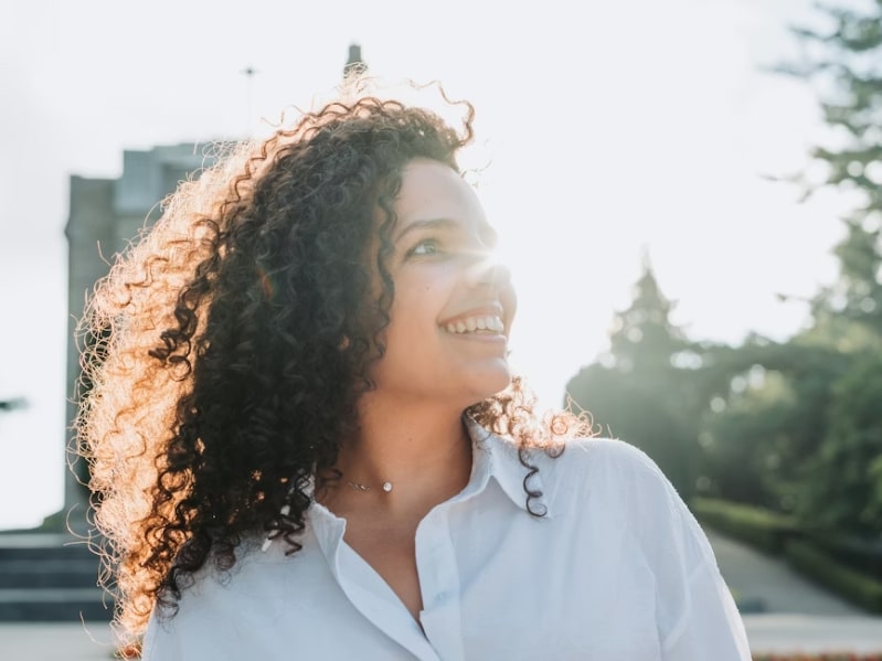 woman smiling in sunshine